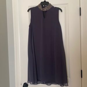 Sleeveless dress with beaded detail collar
